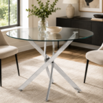 Round glass dining table with chrome-effect metal base